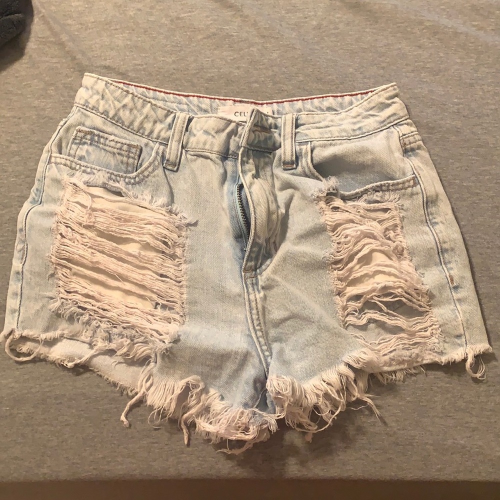 High waisted jean shorts with rips. Cello brand
